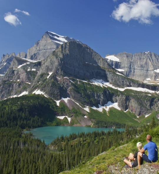 Young Couple enjoying the view in Glacier National Park in northern Montana