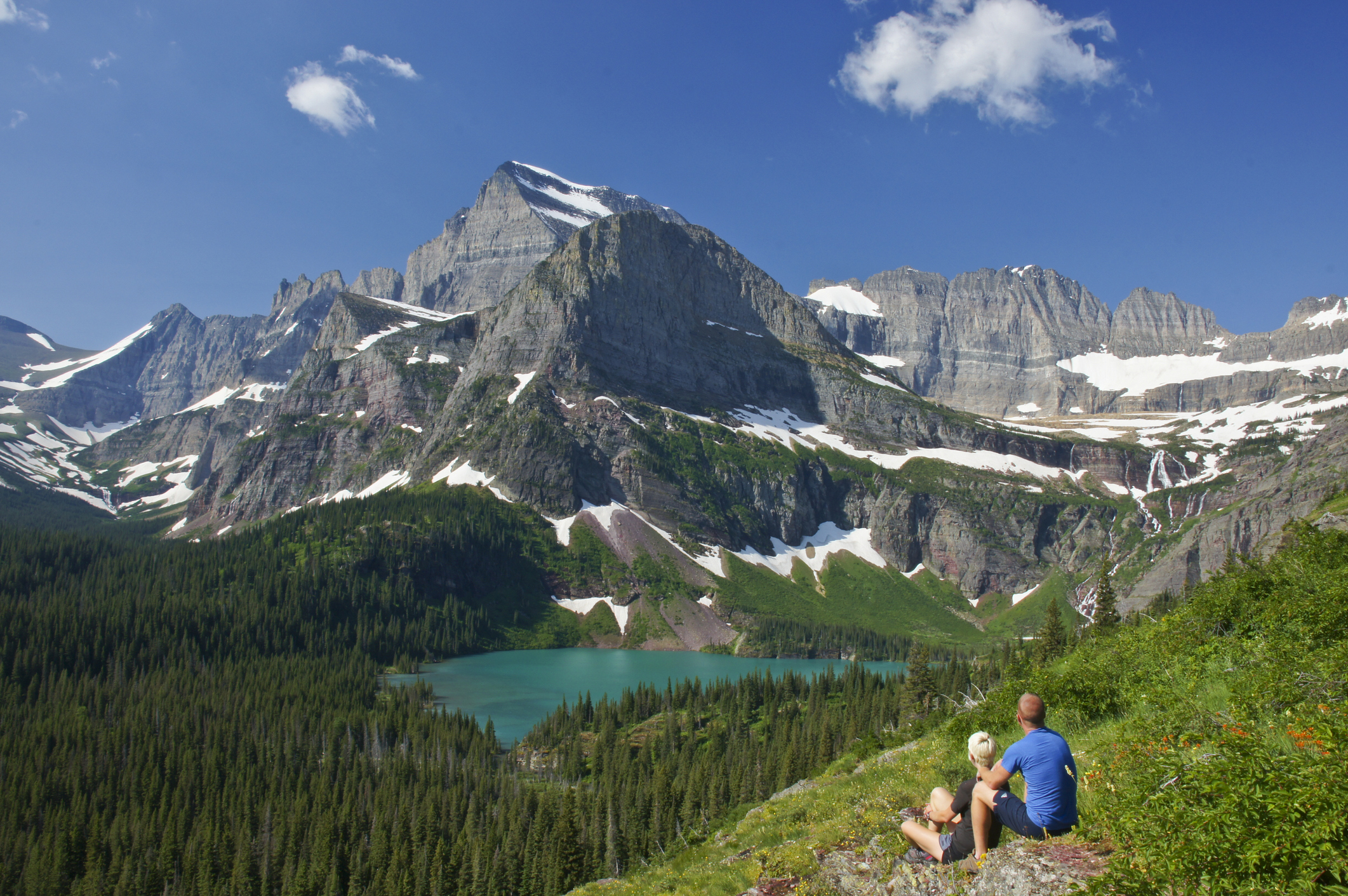 Young Couple enjoying the view in Glacier National Park in northern Montana